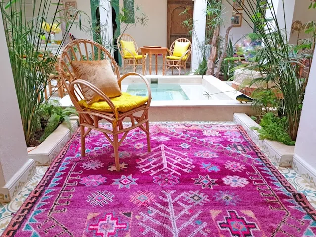 Purple Berber Moroccan Rug Next to a Pool in a Moroccan Riad